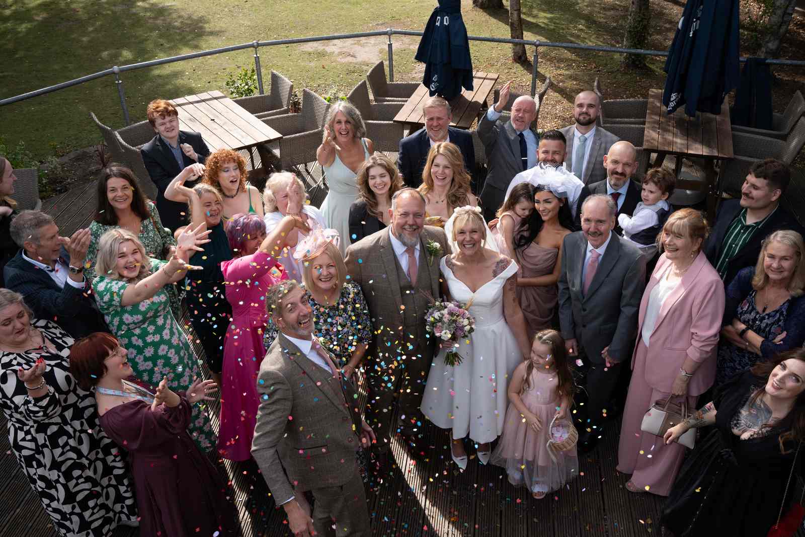 Guests throwing confetti over Chris and Mandy after the ceremony