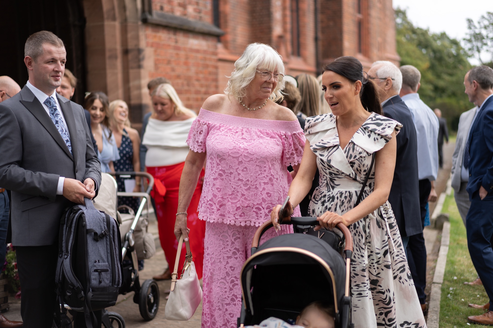 Guests chatting outside the church after the ceremony